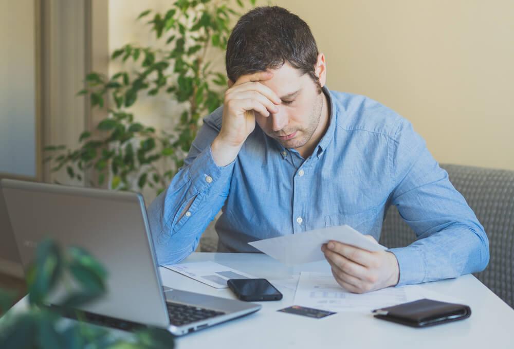 Unhappy-man-with-debts