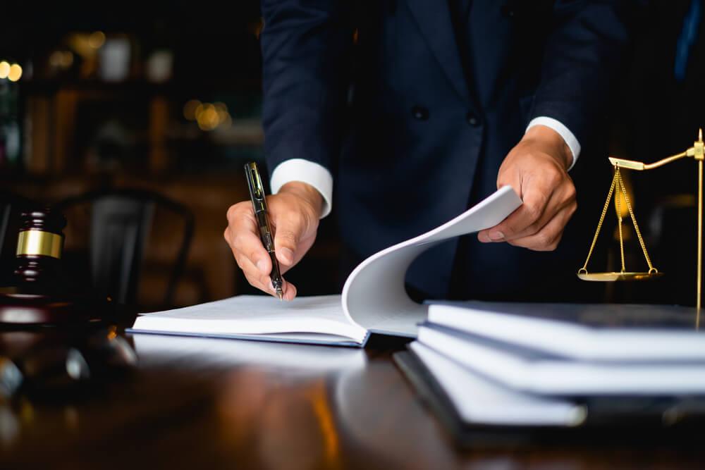 Businessman reading a law book