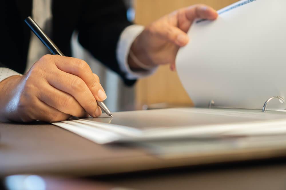 Business man checking register
