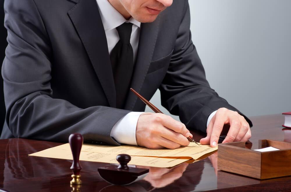 Man signing documents