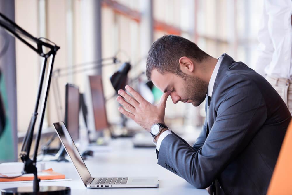 Frustrated business man at his desk
