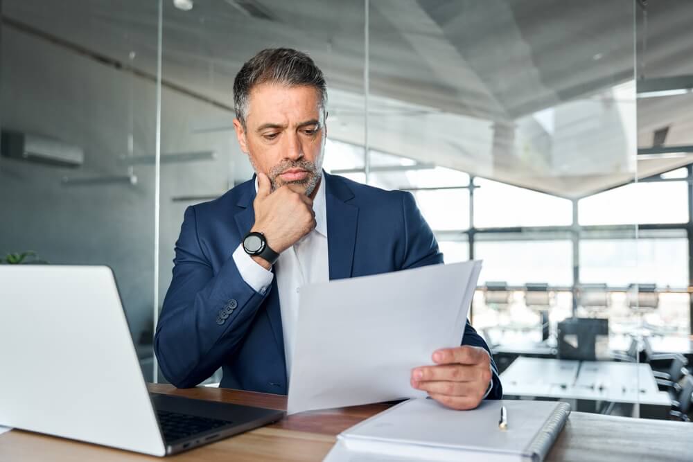 Company director looking at document